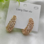 Imported Elegant Textured Hoop Earrings ? Dazzling Gold Finish Earrings - Luxurious Gold Finish | Best Quality Artificial Earrings For Girls & Women Description: Enhance your jewelry collection with these stunning textured hoop earrings. Crafted with intricate latticework and a luxurious gold-tone finish, these earrings exude sophistication and charm. Perfect for both casual outings and formal events, their versatile design ensures you?ll always stand out in the crowd. Lightweight and comfortable to wear, these hoops are your go-to accessory for an effortlessly chic look. Key Features: ? Exquisite lattice texture for added elegance ? High-quality gold-tone finish for a luxurious touch ? Lightweight and comfortable for all-day wear ? Ideal for any occasion: casual, formal, or festive ? Easy-to-wear secure clasp Original Video
