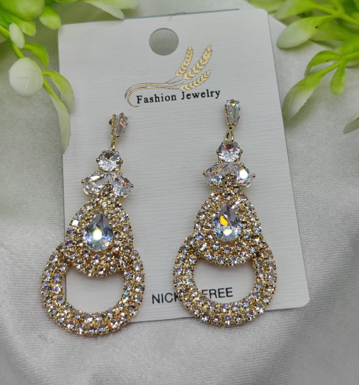 Imported Crystal Teardrop Earrings for Women | Glamorous Sparkling Design with Luxurious Gold Finish | Nickel-Free Artificial Earrings for Girls & Women Imported Crystal Teardrop Earrings for Women | Glamorous Sparkling Design with Luxurious Gold Finish | Nickel-Free Artificial Earrings for Girls & Women